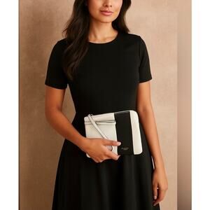 Isaac Mizrahi whit with black stripe clutch